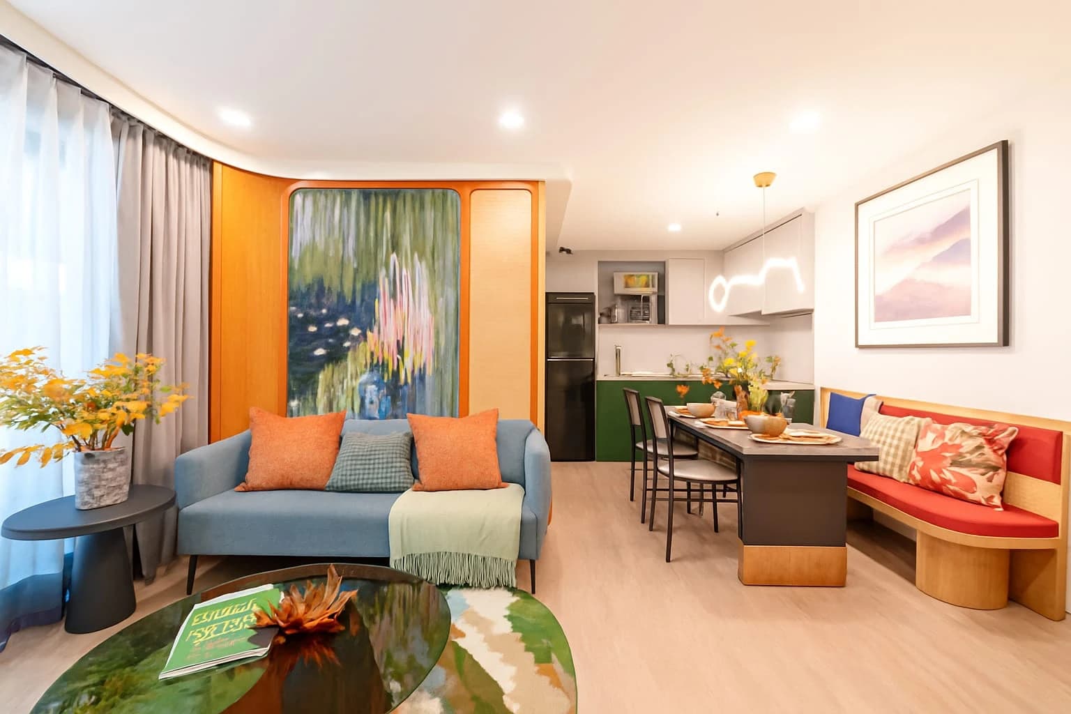 One-bedroom Plus show unit, 44 m²: living room with the blue sofa and the built-in dining bench